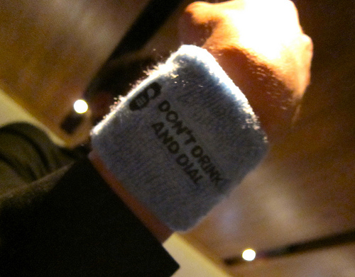 photo of armband reading "Don't Drink and Dial"