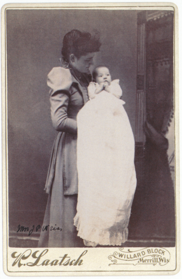 Frances Weiss holding a child