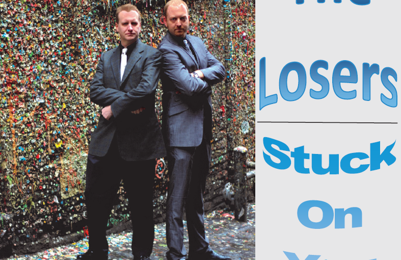 Album Cover of Stuck On You by The Losers, showing two men standing by Seattle's Gum Wall