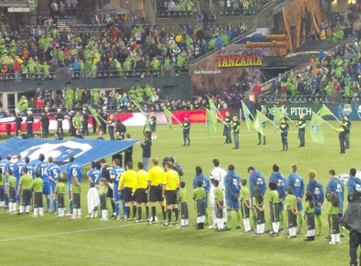 Seattle Sounders and Montreal Impact line up for the national anthem